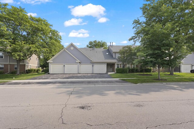 78 Holmes Way Unit W1, Schaumburg, IL 60193 - view of front of house featuring a garage, asphalt driveway, and a front yard