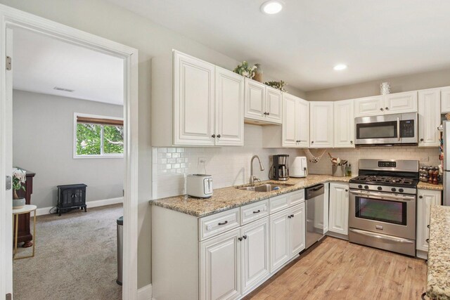 16301 Sherwood Dr, Orland Park, IL 60462 - kitchen with appliances with stainless steel finishes, decorative backsplash, white cabinetry, and recessed lighting