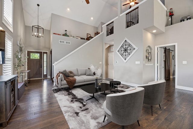 565 Sudbury Cir Unit 0, Oswego, IL 60543 - living room with a high ceiling, ceiling fan, dark wood finished floors, stairs, and a chandelier