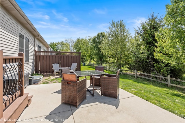 565 Sudbury Cir Unit 0, Oswego, IL 60543 - view of patio / terrace featuring outdoor dining space and view of wooded area