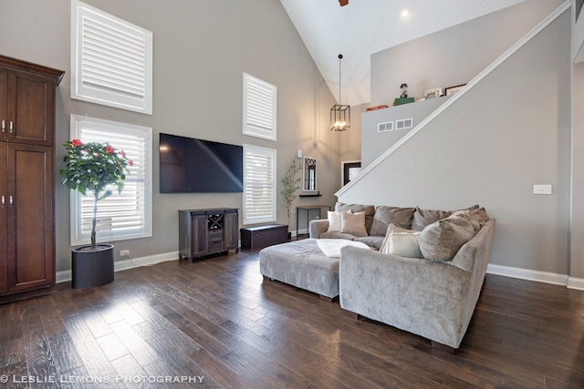 565 Sudbury Cir Unit 0, Oswego, IL 60543 - living room featuring high vaulted ceiling, stairs, and dark wood-style floors