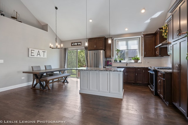 565 Sudbury Cir Unit 0, Oswego, IL 60543 - kitchen featuring appliances with stainless steel finishes, light stone countertops, a chandelier, backsplash, and recessed lighting