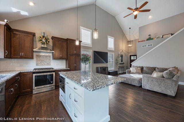 565 Sudbury Cir Unit 0, Oswego, IL 60543 - kitchen with appliances with stainless steel finishes, high vaulted ceiling, wall chimney exhaust hood, open floor plan, and light stone counters
