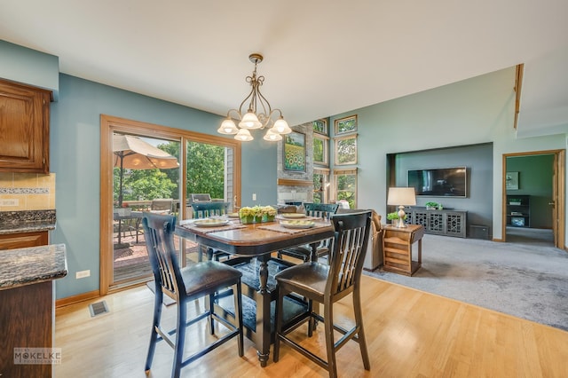 3624 Eliot Ln, Naperville, IL 60564 - dining space with a chandelier and light wood-style flooring
