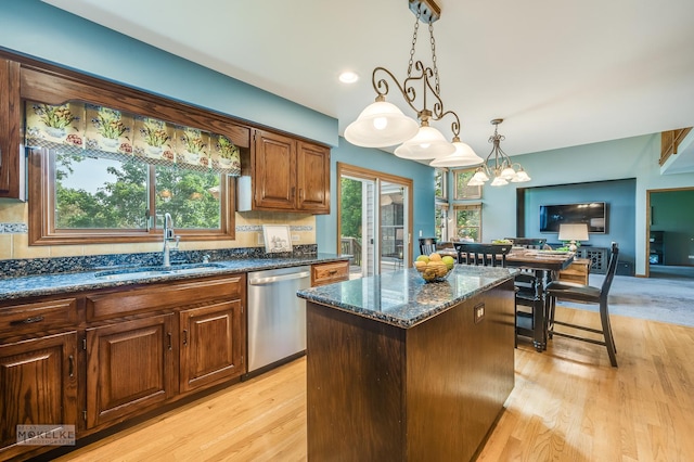 3624 Eliot Ln, Naperville, IL 60564 - kitchen with dishwasher, a center island, dark stone countertops, hanging light fixtures, and light wood finished floors