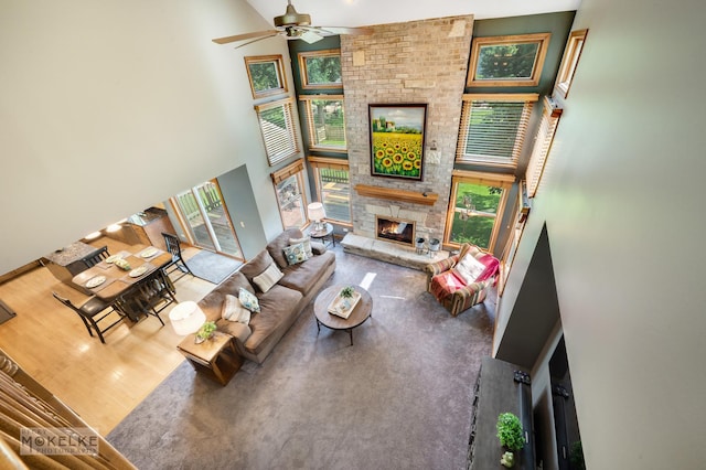 3624 Eliot Ln, Naperville, IL 60564 - living room with a high ceiling, a ceiling fan, and a stone fireplace