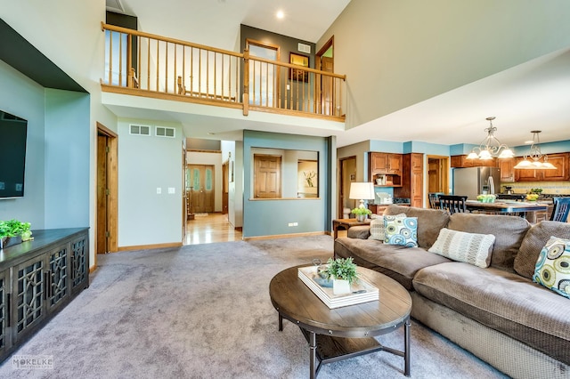 3624 Eliot Ln, Naperville, IL 60564 - living room with a chandelier, light carpet, and a towering ceiling