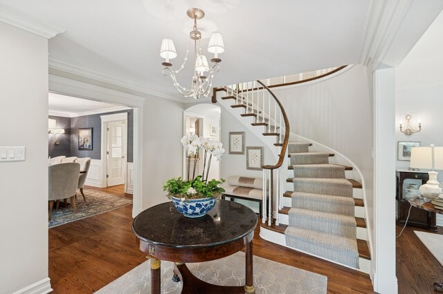 611 Oak Knoll Dr, Lake Forest, IL 60045 - entrance foyer featuring stairs, crown molding, wood finished floors, and a chandelier
