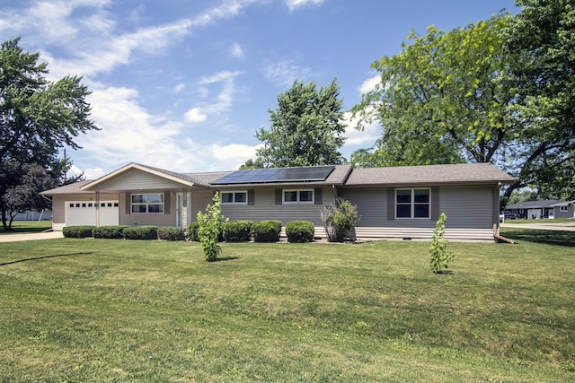 400 W Adams St, Danforth, IL 60930 - ranch-style house featuring an attached garage, roof mounted solar panels, a front yard, crawl space, and driveway