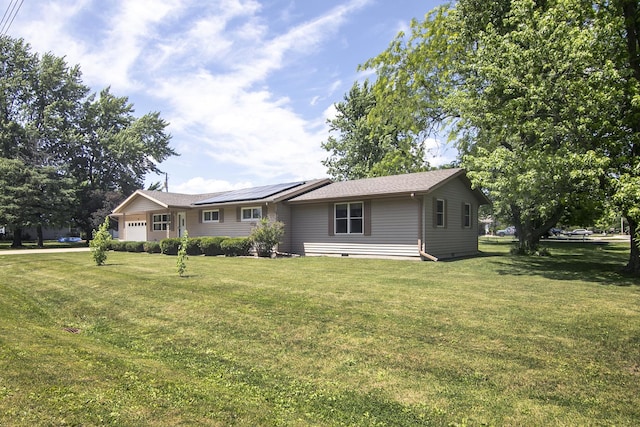 400 W Adams St, Danforth, IL 60930 - ranch-style home featuring a garage, roof mounted solar panels, a front yard, and crawl space