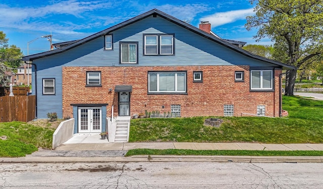 9712 W Shore Dr, Oak Lawn, IL 60453 - view of front facade with french doors, a chimney, and brick siding