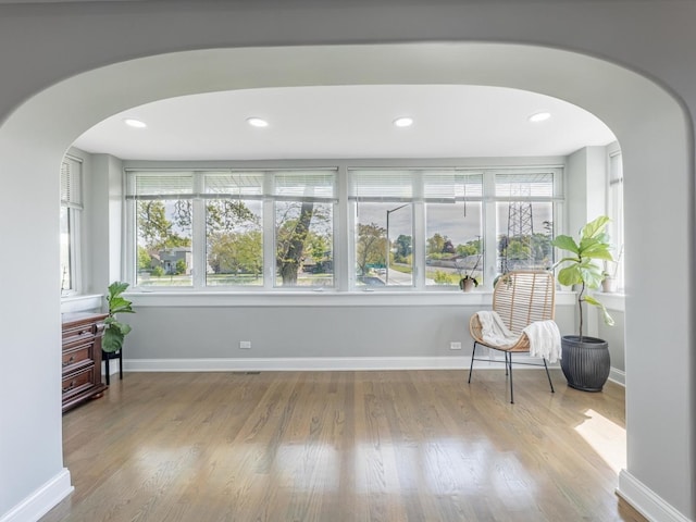 9712 W Shore Dr, Oak Lawn, IL 60453 - living area featuring arched walkways, wood finished floors, and recessed lighting
