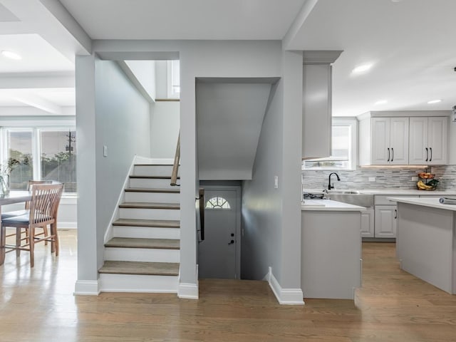 9712 W Shore Dr, Oak Lawn, IL 60453 - stairway with plenty of natural light, wood finished floors, and recessed lighting