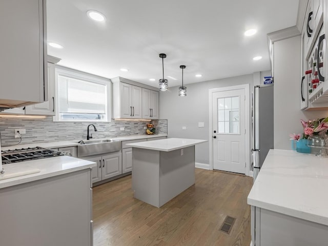 9712 W Shore Dr, Oak Lawn, IL 60453 - kitchen featuring decorative backsplash, freestanding refrigerator, recessed lighting, light wood finished floors, and decorative light fixtures