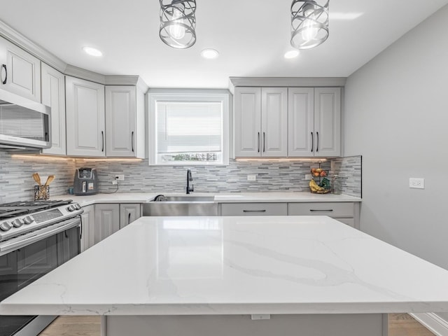 9712 W Shore Dr, Oak Lawn, IL 60453 - kitchen with stainless steel appliances, backsplash, pendant lighting, light stone countertops, and recessed lighting