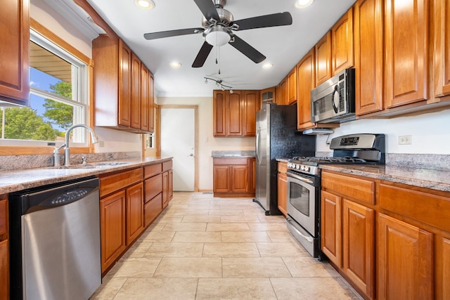 11 E Appletree Ln, Arlington Heights, IL 60004 - kitchen featuring appliances with stainless steel finishes, brown cabinets, recessed lighting, ceiling fan, and light stone counters