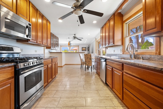 11 E Appletree Ln, Arlington Heights, IL 60004 - kitchen with appliances with stainless steel finishes, a ceiling fan, brown cabinets, recessed lighting, and light tile patterned flooring
