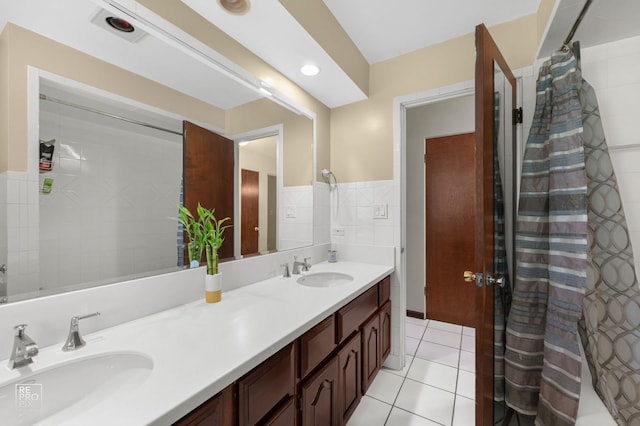 641 E Belmont Ave, Addison, IL 60101 - full bath with double vanity, tile patterned floors, and tile walls