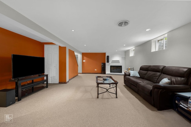 641 E Belmont Ave, Addison, IL 60101 - carpeted living area with recessed lighting and a brick fireplace