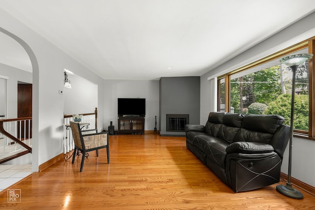 641 E Belmont Ave, Addison, IL 60101 - living area with light wood-style flooring and arched walkways