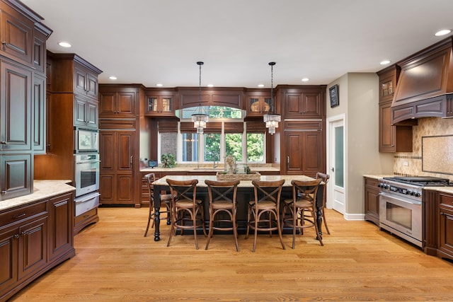1091 Johnson Dr, Naperville, IL 60540 - kitchen featuring stainless steel appliances, a warming drawer, recessed lighting, custom exhaust hood, and light wood-style flooring