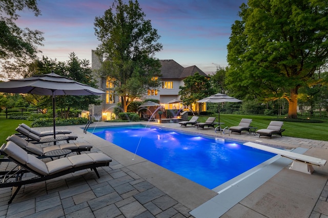 1091 Johnson Dr, Naperville, IL 60540 - pool at dusk with a patio, a yard, and an outdoor pool