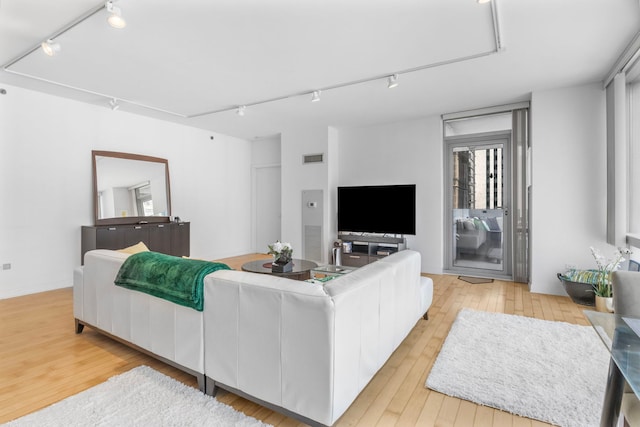 8 E Randolph St Unit 1401, Chicago, IL 60601 - living room with light wood-style floors and track lighting