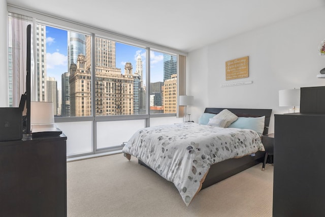 8 E Randolph St Unit 1401, Chicago, IL 60601 - carpeted bedroom featuring a view of skyline and a wall of windows