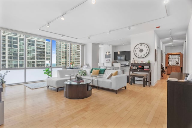 8 E Randolph St Unit 1401, Chicago, IL 60601 - living area featuring track lighting, light wood-style floors, and a wall of windows