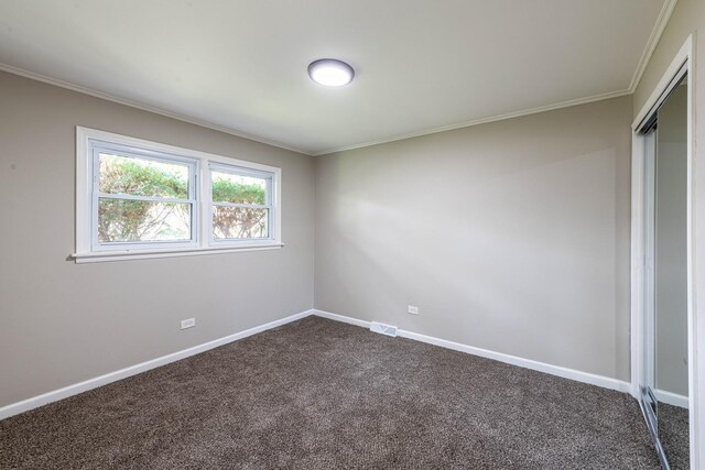 14415 Avalon Ave, Dolton, IL 60419 - spare room with dark carpet and crown molding