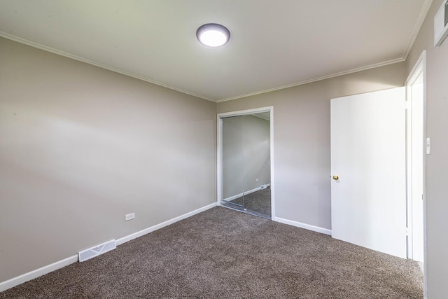 14415 Avalon Ave, Dolton, IL 60419 - unfurnished bedroom featuring dark colored carpet, crown molding, and a closet