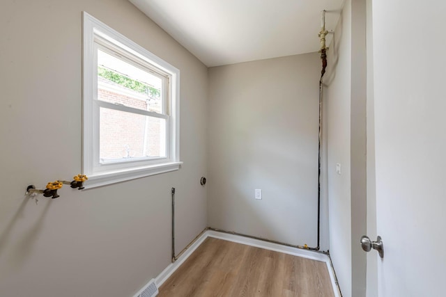 14415 Avalon Ave, Dolton, IL 60419 - laundry area with light wood finished floors and baseboards