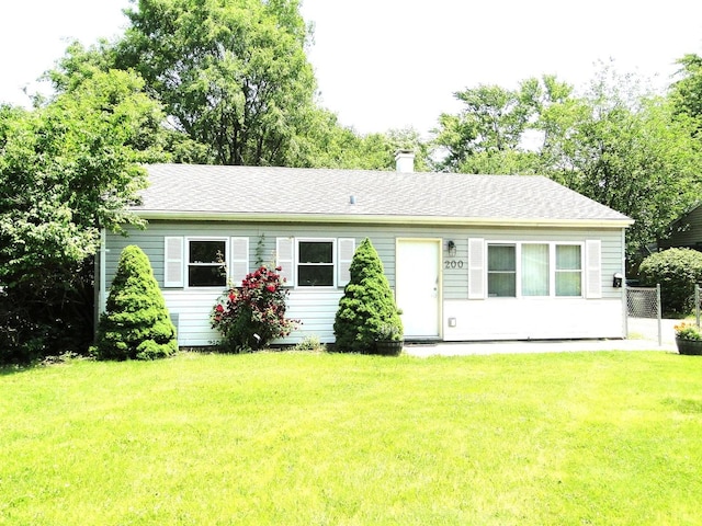 200 Romayne Ave, Joliet, IL 60436 - back of property featuring a lawn, a chimney, and roof with shingles