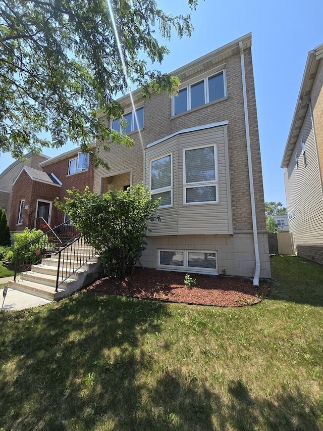 8620 S Normal Ave, Chicago, IL 60620 - view of front of home featuring a front lawn and brick siding