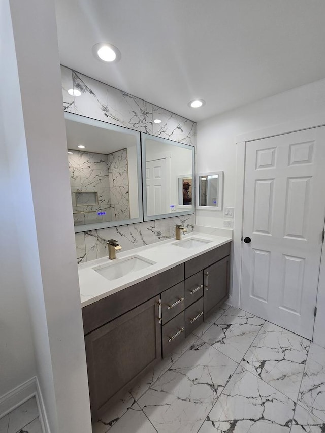 8620 S Normal Ave, Chicago, IL 60620 - bathroom featuring double vanity, marble finish flooring, recessed lighting, and tasteful backsplash