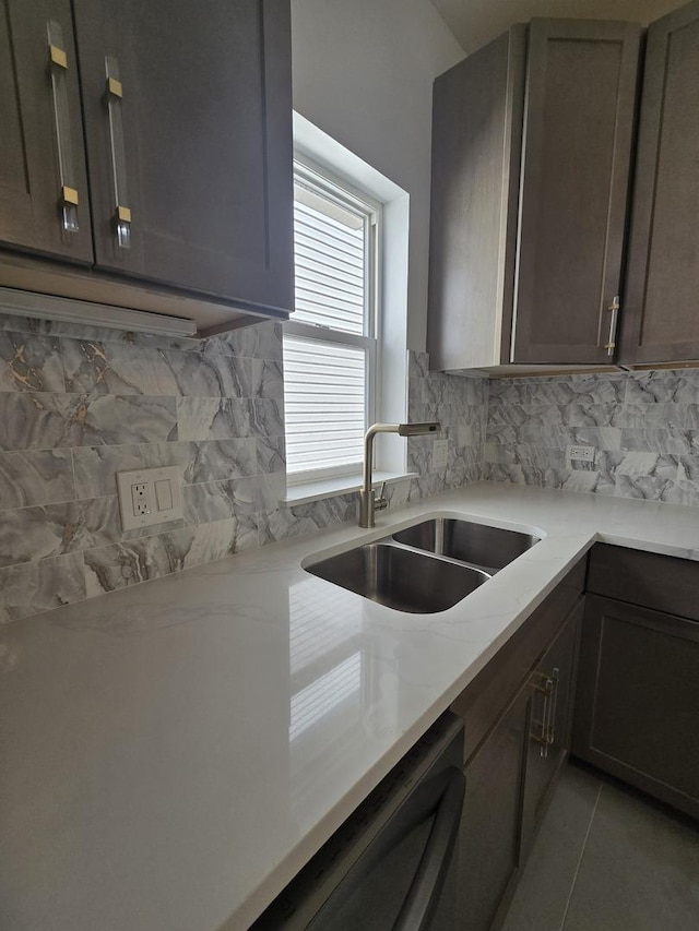 8620 S Normal Ave, Chicago, IL 60620 - kitchen featuring dishwashing machine, backsplash, light countertops, and light tile patterned floors