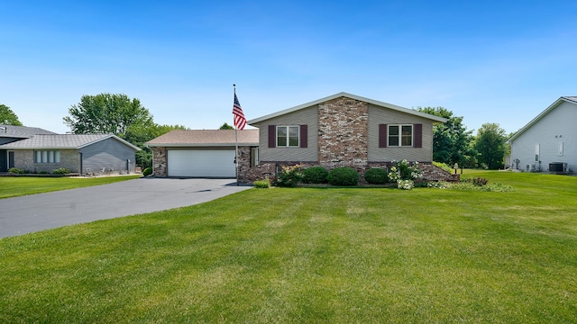 1320 Lake Summerset Rd, Davis, IL 61019 - view of front of property featuring a front yard, driveway, an attached garage, and brick siding