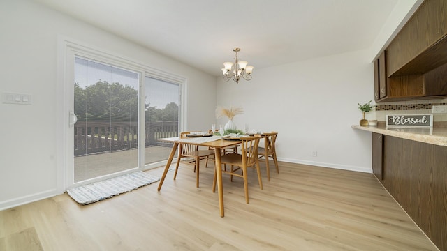 1320 Lake Summerset Rd, Davis, IL 61019 - dining area with a chandelier and light wood-style floors