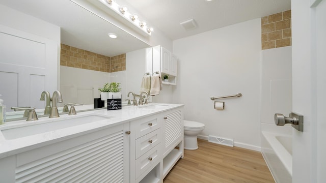 1320 Lake Summerset Rd, Davis, IL 61019 - full bath featuring double vanity, shower / bathtub combination, and wood finished floors