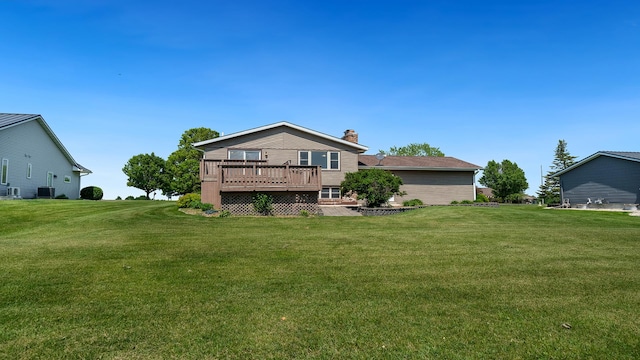 1320 Lake Summerset Rd, Davis, IL 61019 - back of house featuring a chimney, a deck, and a lawn
