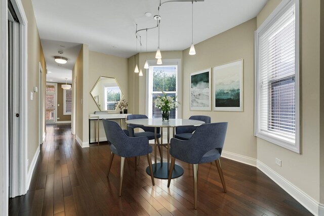 2732 W Belmont Ave, Chicago, IL 60618 - dining area featuring dark wood-style flooring and baseboards