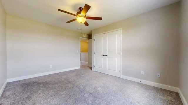 748 Sedgegrass Dr, Champaign, IL 61822 - unfurnished bedroom featuring carpet floors, a closet, and ceiling fan