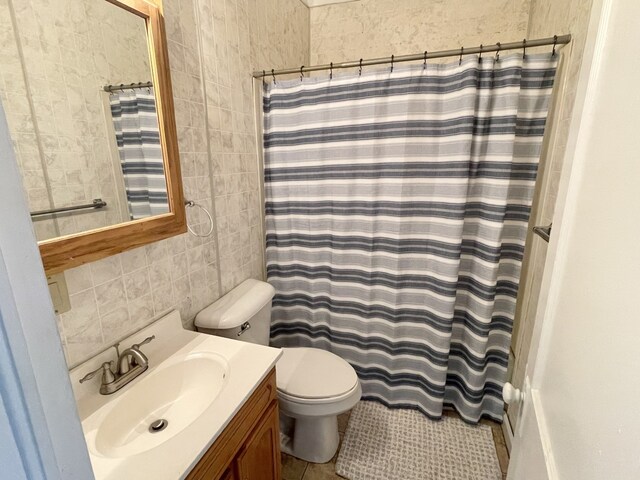 42 2nd St, Lasalle, IL 61301 - bathroom featuring vanity, tile walls, tile patterned floors, and a shower with shower curtain
