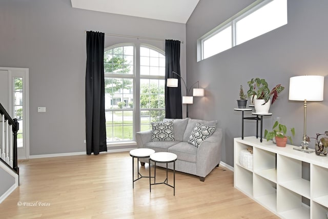 2012 Spring Creek Ln, Mchenry, IL 60050 - living area featuring light wood finished floors, stairway, and lofted ceiling