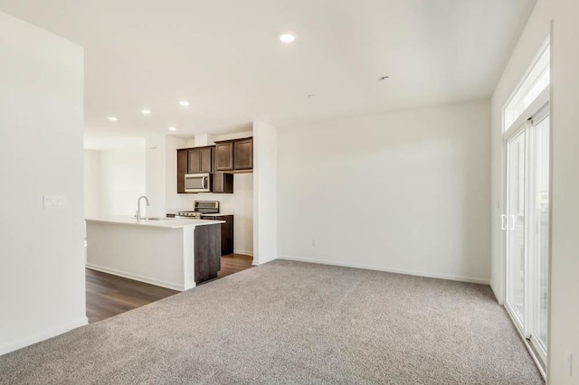 2167 Yellowstone Blvd, Mundelein, IL 60060 - kitchen featuring dark colored carpet, stainless steel appliances, dark brown cabinets, light countertops, and recessed lighting