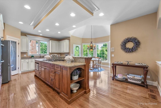 675 Oak Ln, South Elgin, IL 60177 - kitchen with appliances with stainless steel finishes, white cabinetry, brown cabinetry, open shelves, and a center island