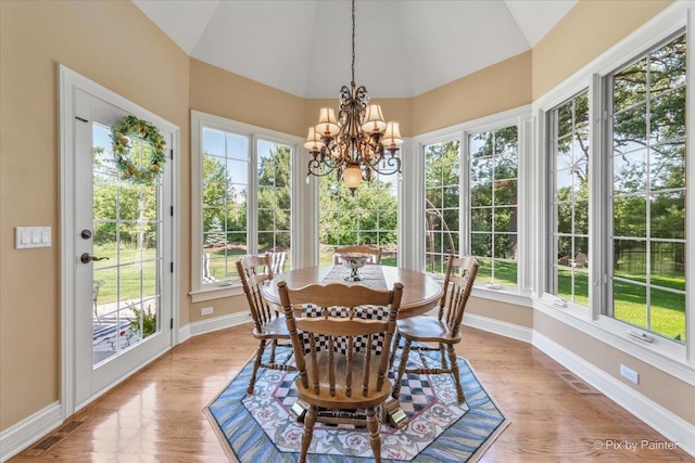 675 Oak Ln, South Elgin, IL 60177 - sunroom / solarium featuring vaulted ceiling, a chandelier, and wood finished floors