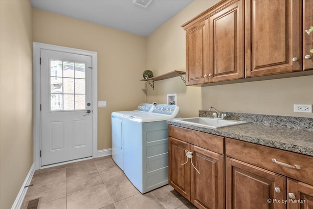 675 Oak Ln, South Elgin, IL 60177 - laundry area featuring washing machine and clothes dryer, cabinet space, and light tile patterned floors