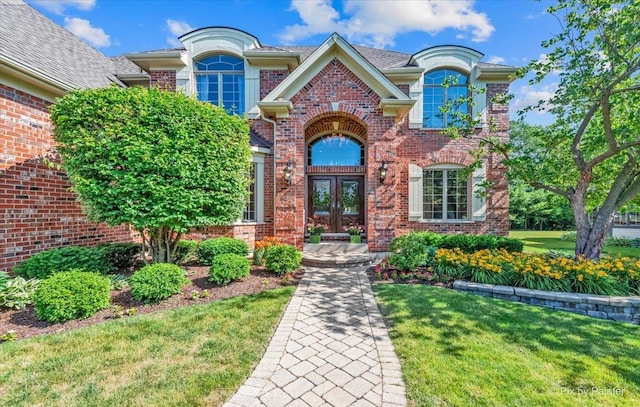 675 Oak Ln, South Elgin, IL 60177 - property entrance featuring french doors, brick siding, and a yard