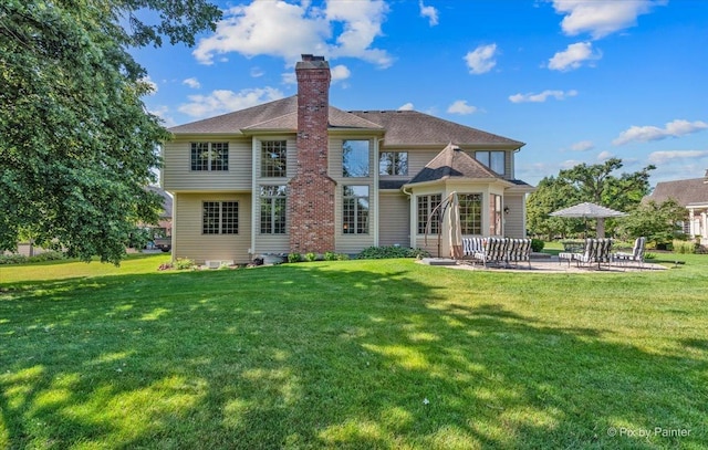675 Oak Ln, South Elgin, IL 60177 - back of property featuring a chimney, a patio, and a yard